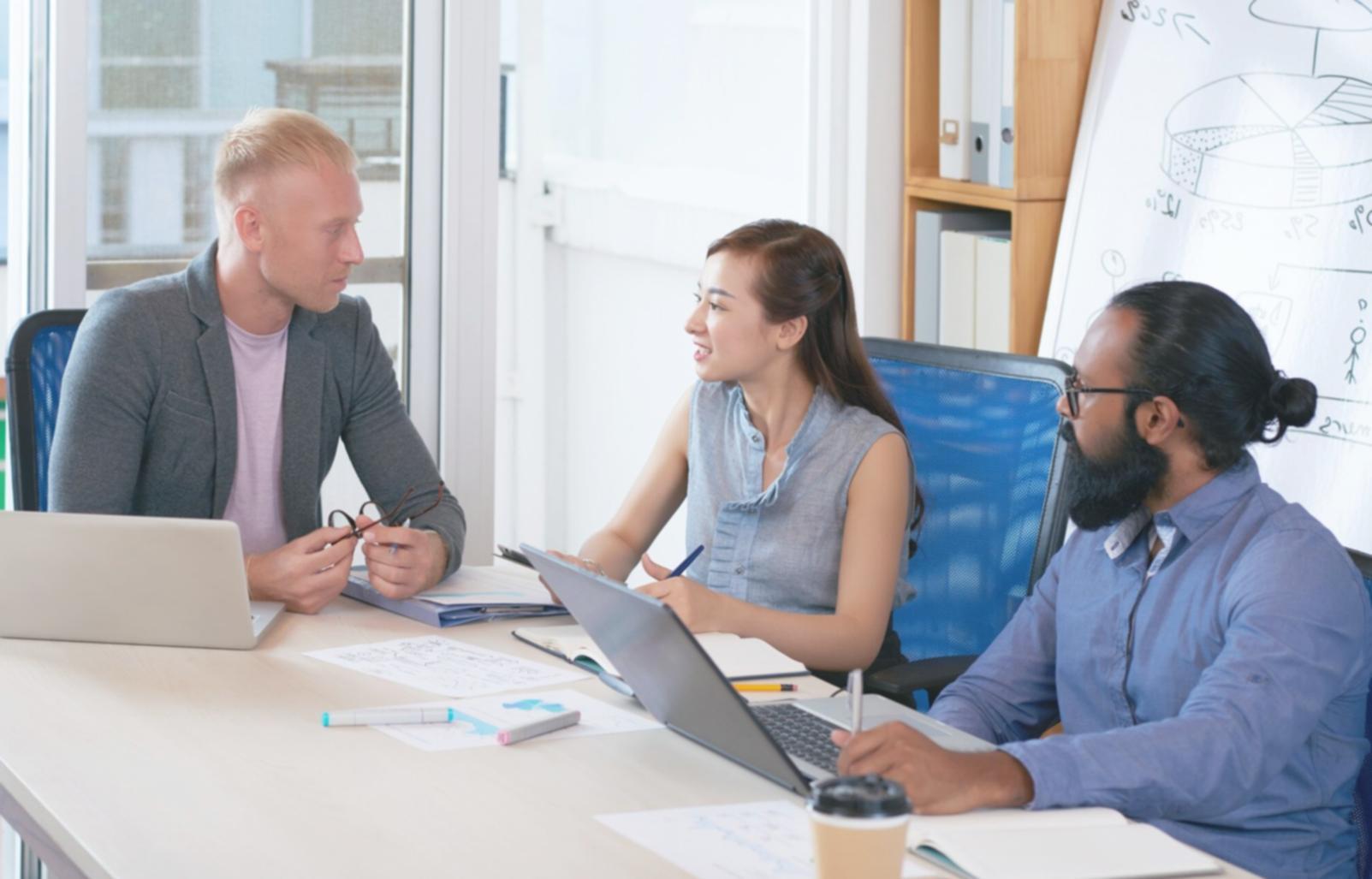 Students engaged in collaborative financial analysis workshop