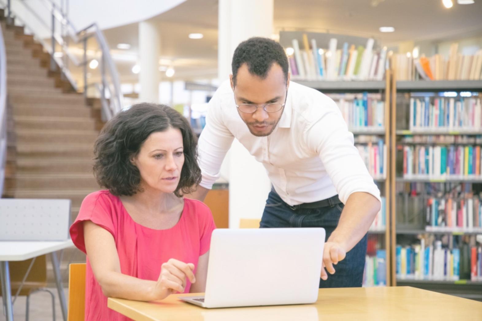 Student reviewing financial data and analysis materials